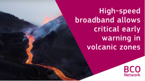 Text over photo of a winding stream of smoking lava flowing down forested hills: High-speed broadband allows critical early warning in volcanic zones.