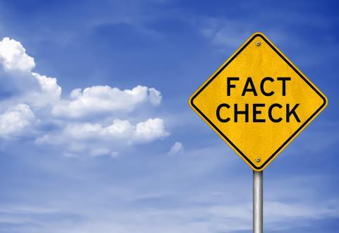 graphic with a traffic sign showing the word fact check